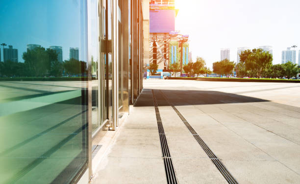 istock Empty city street near by glass wall 948563670