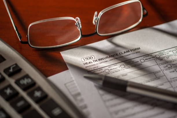 istock Getting ready to file a health insurance claim form 948566972