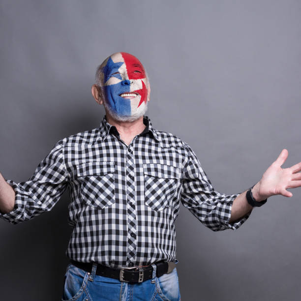 istock Senior man with Panama flag painted on his face 948571536