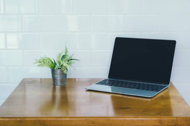 istock empty computer laptop with highlight pen on table in coffee shop with copy space. freelance concept, still holiday concept, relax working concept. digital technology. 948577202