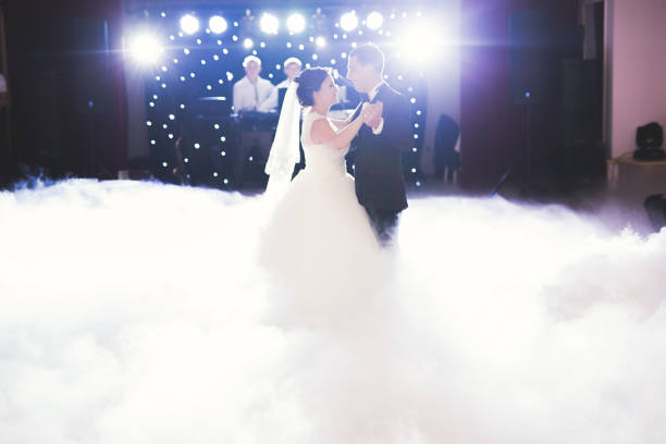 istock Beautiful caucasian wedding couple just married and dancing their first dance 948577686