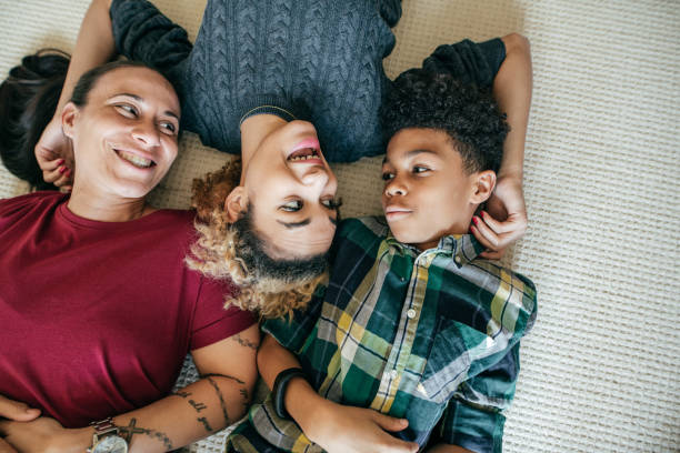 istock LGBTQ family relaxing on a weekend, 948588558