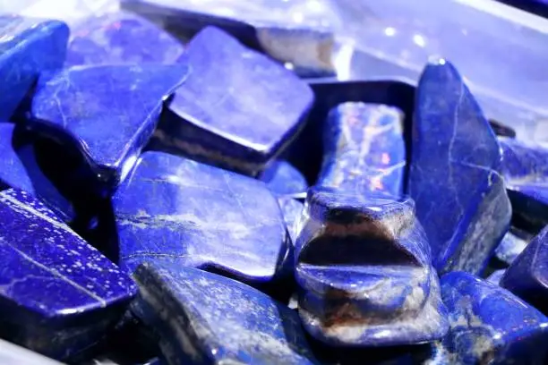 Cobalt blue lapis lazuli stones. Selected focus. Mineralien exibition.