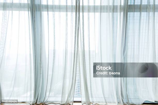 White Curtain Hanging In The Window Stock Photo - Download Image Now - Curtain, Window, White Color