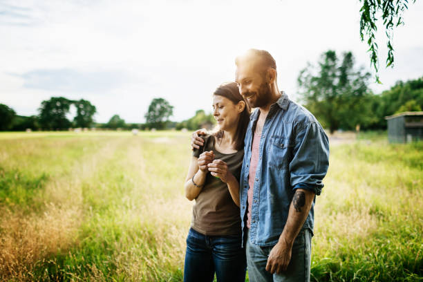 Couple Embrace Outdoors in The Afternoon Sun