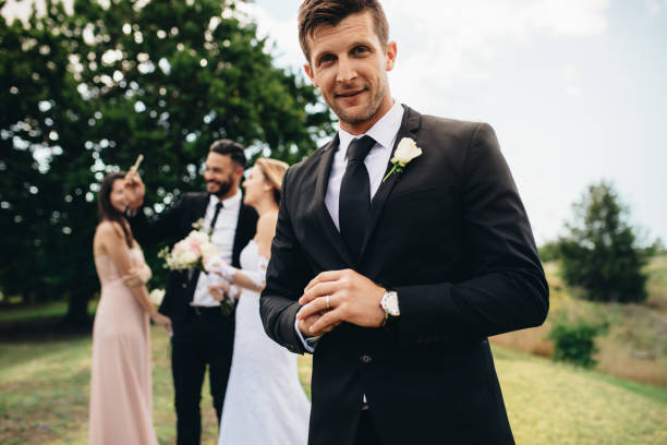 istock Handsome groom looking happy on his wedding day 948597990