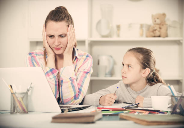 istock Irritated mother watching at the mistakes 948602934