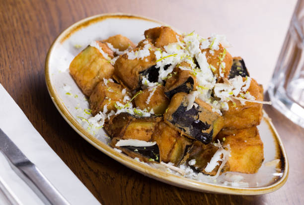istock Plate with steamed eggplants with honey and cheese 948610722