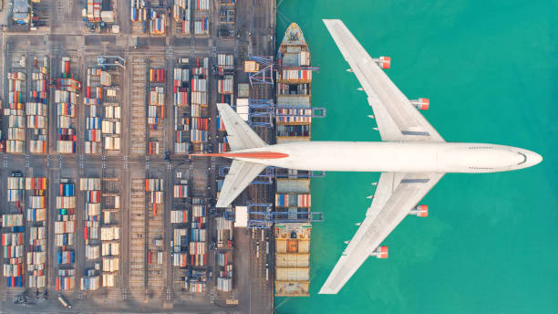 istock Container ships and transport aircraft in the export and import business and logistics international goods. Shipping cargo to harbor by crane. Aerial view and top view. 948614302