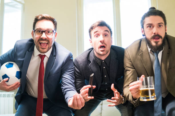 istock Three amazed men watching football game 948614530