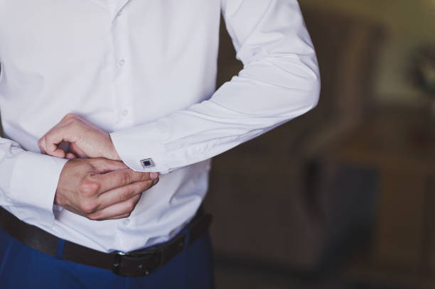 istock A businessman buttoning cuff white shirts 9985. 948617530