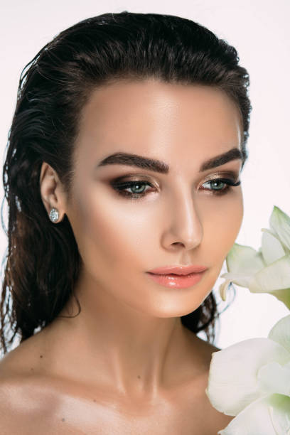 istock beauty and spa, female face with a flower 948622566