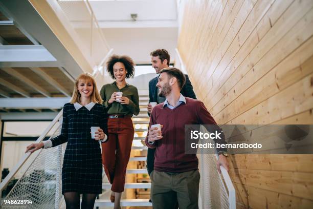 A Quick Coffee Break Stock Photo - Download Image Now - Walking, Employee, Discussion