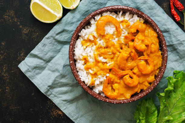 istock Shrimp in curry sauce with rice. 948631218
