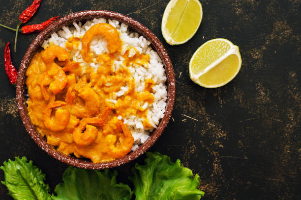 istock Thai shrimp dish in curry sauce with rice. 948631942