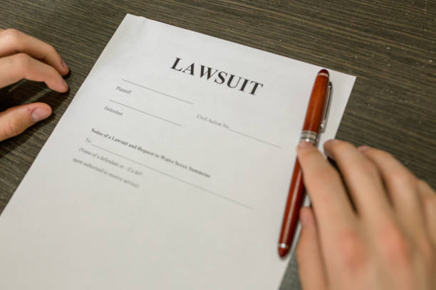 istock man hand sign on contract document with fountain pen, 948632352