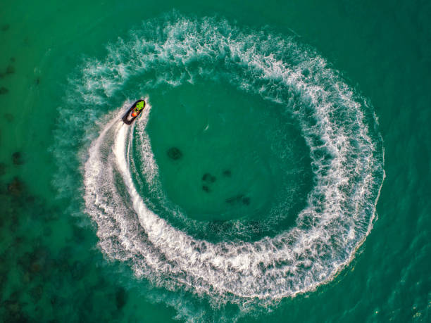 istock People are playing jet ski at sea during the holidays. 948632614