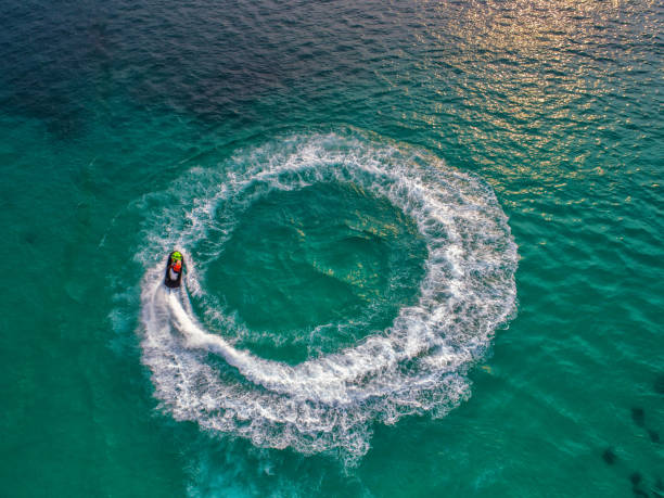 istock People are playing jet ski at sea during the holidays. 948632662