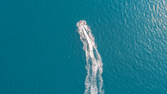 People are playing jet ski at sea during the holidays.