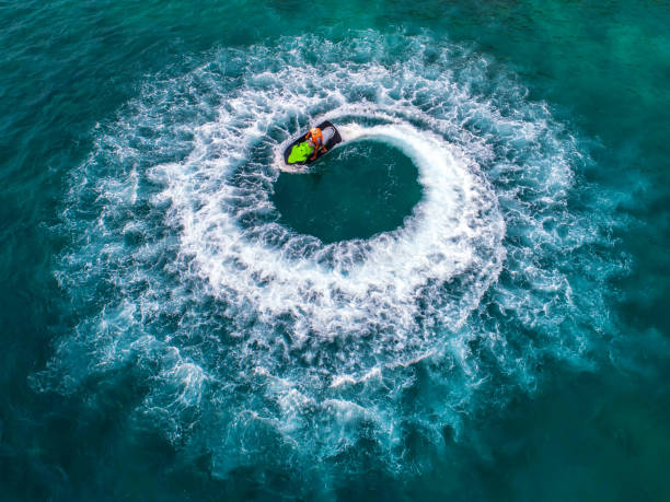 istock People are playing jet ski at sea during the holidays. 948632714