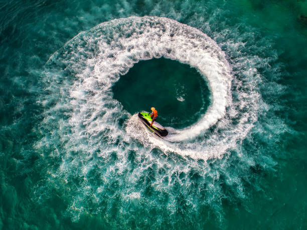 istock People are playing jet ski at sea during the holidays. 948632738