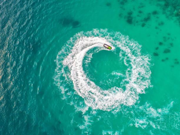 istock People are playing jet ski at sea during the holidays. 948632776