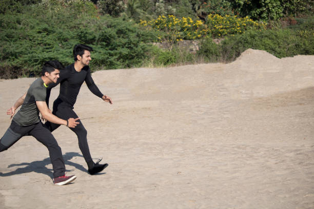 istock Men jogging outdoors in nature 948634998