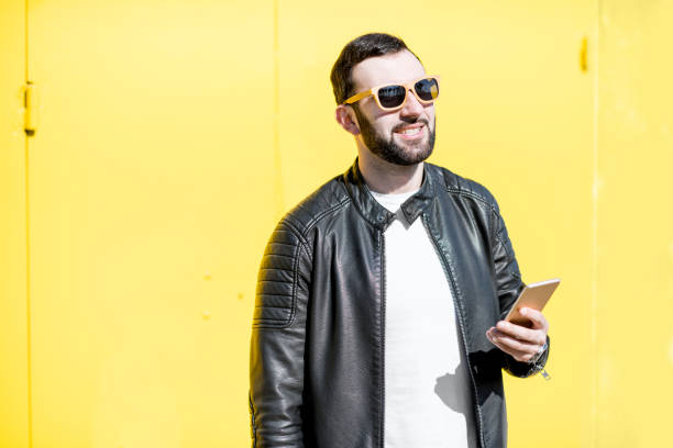 istock Man portrait on the yellow background 948636044