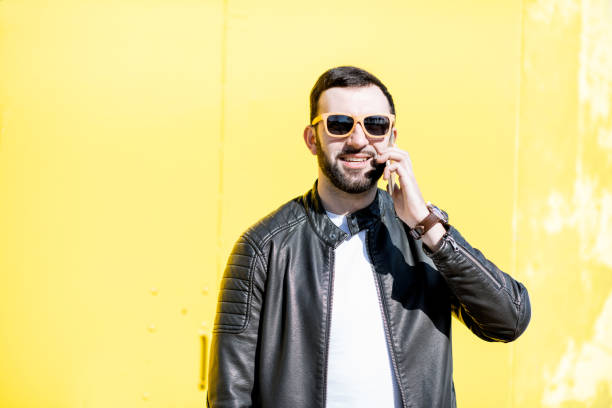 istock Man portrait on the yellow background 948636076
