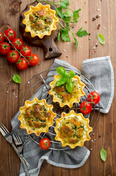 istock Baked homemade quiche pie in mini metal forms 948636210