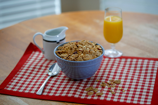 bowl of multigrain cereal with granola and almonds
