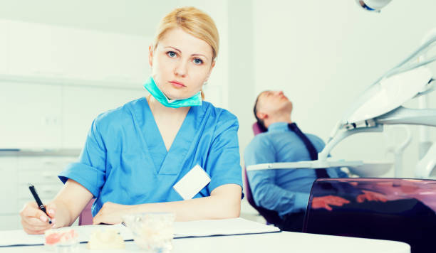 Young smiling woman sitting on a dentist's chair