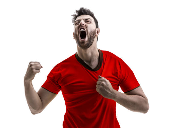 istock Fan / Sport Player on red uniform celebrating on white background 948647452