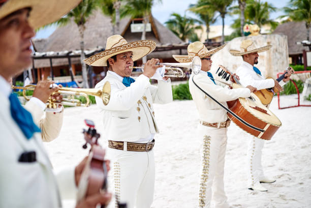 traditional mexican music band playing trumpet and classical guitar for the beach wedding - polka dancing imagens e fotografias de stock