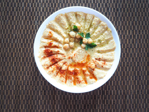 istock Dishes of chickpeas. Hummus. Lean middle Eastern cuisine. 948655038