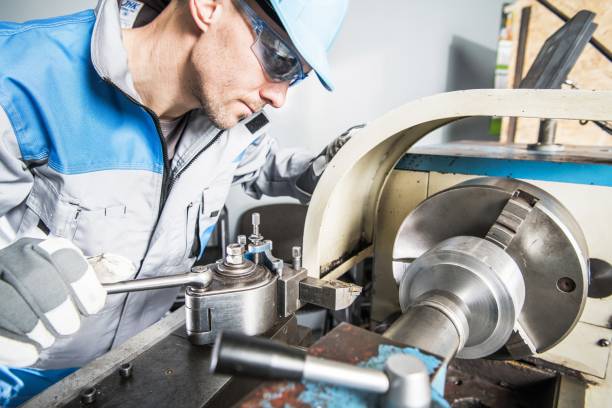 Lathe Technician at Work Lathe Technician at Work. Caucasian Metal Industry Worker. spindle stock pictures, royalty-free photos & images