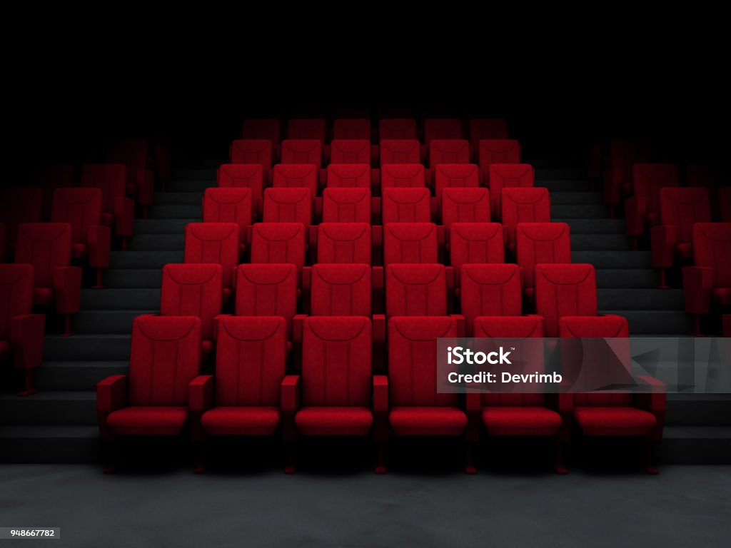 Cinema Salon and Red Seats Movie theater in the dark. Movie Theater Stock Photo