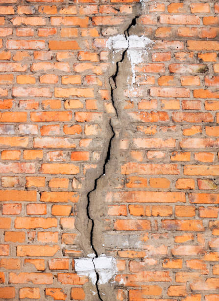 istock A crack in an old brick wall. Texture. Background 948668188