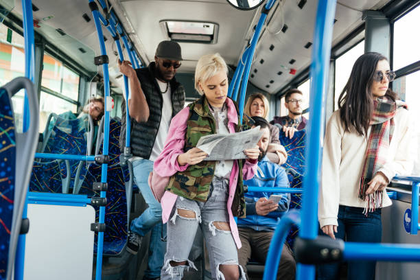 istock Blonde woman looking for job vacancy while commuting 948671012