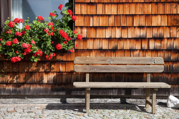 istock Wooden bench in the front yard 948671466