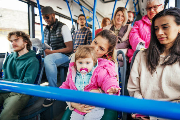 istock Granny with her granddaughter in the bus 948671764