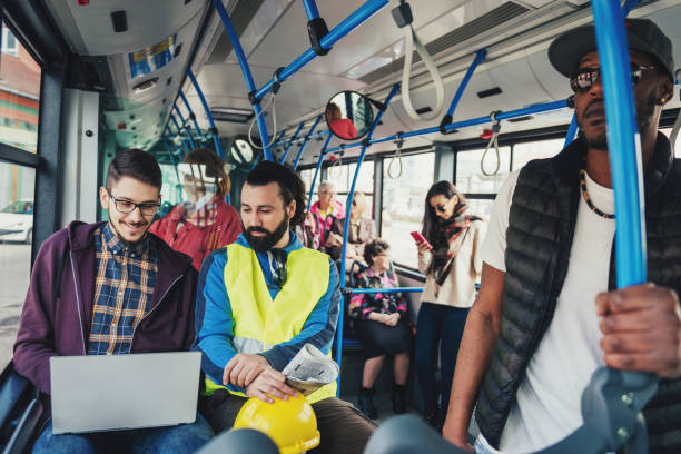 istock Different people commuting by public bus in France 948674218