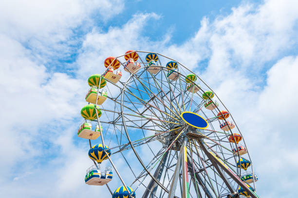 istock Colorful Ferris wheel against the blue sky 948675514
