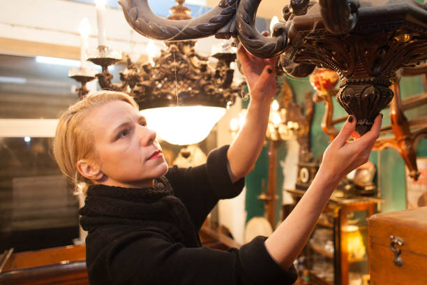 istock Woman Holding Antique At Store 948675870