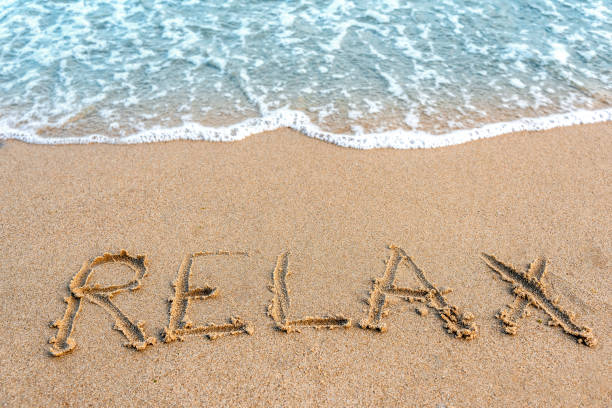 istock Inscription relax on the sand 948675916