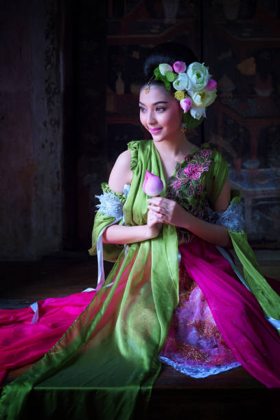 istock Beautiful Bride In Traditional Clothing Sitting On Table 948678234