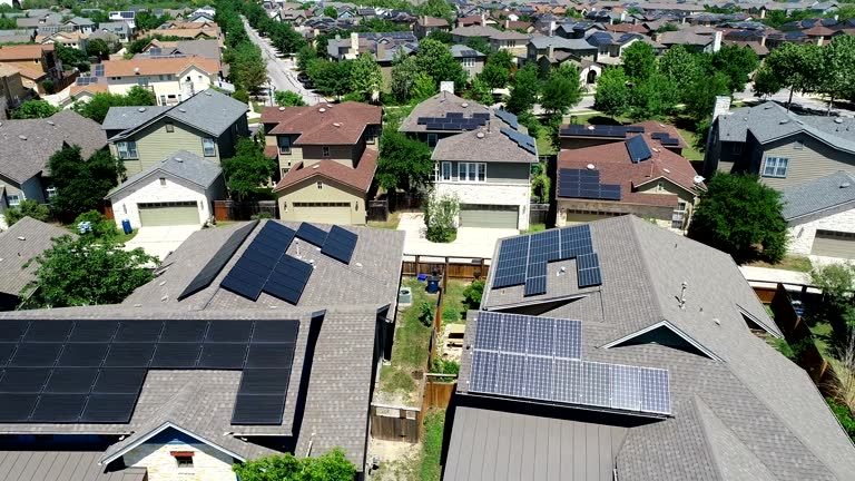 Mueller New Development Suburb with Rooftop Solar Panels in Austin , Texas - Aerial View - Orbiting around Solar Rooftops