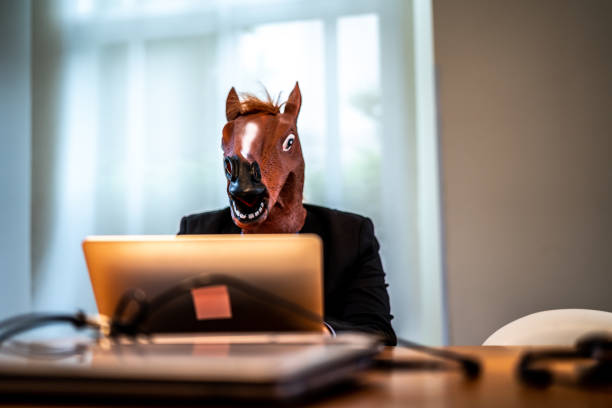 istock Business man with Horse Mask Working at Office 948679004