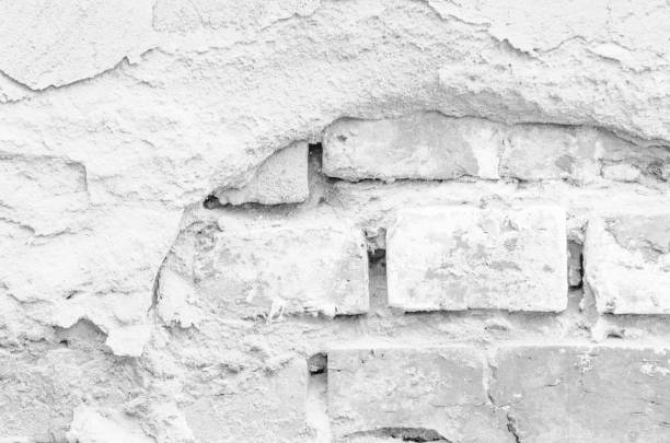 istock Texture of a white ruined brick wall 948679016