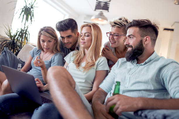 istock Group of playful young people having great time at home 948679326